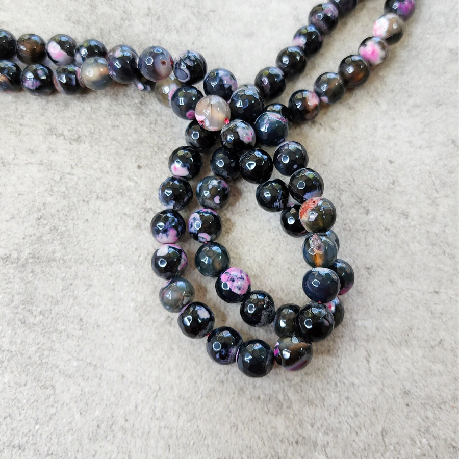 Piedras naturales: Ágata facetada negro con rosa 10mm
